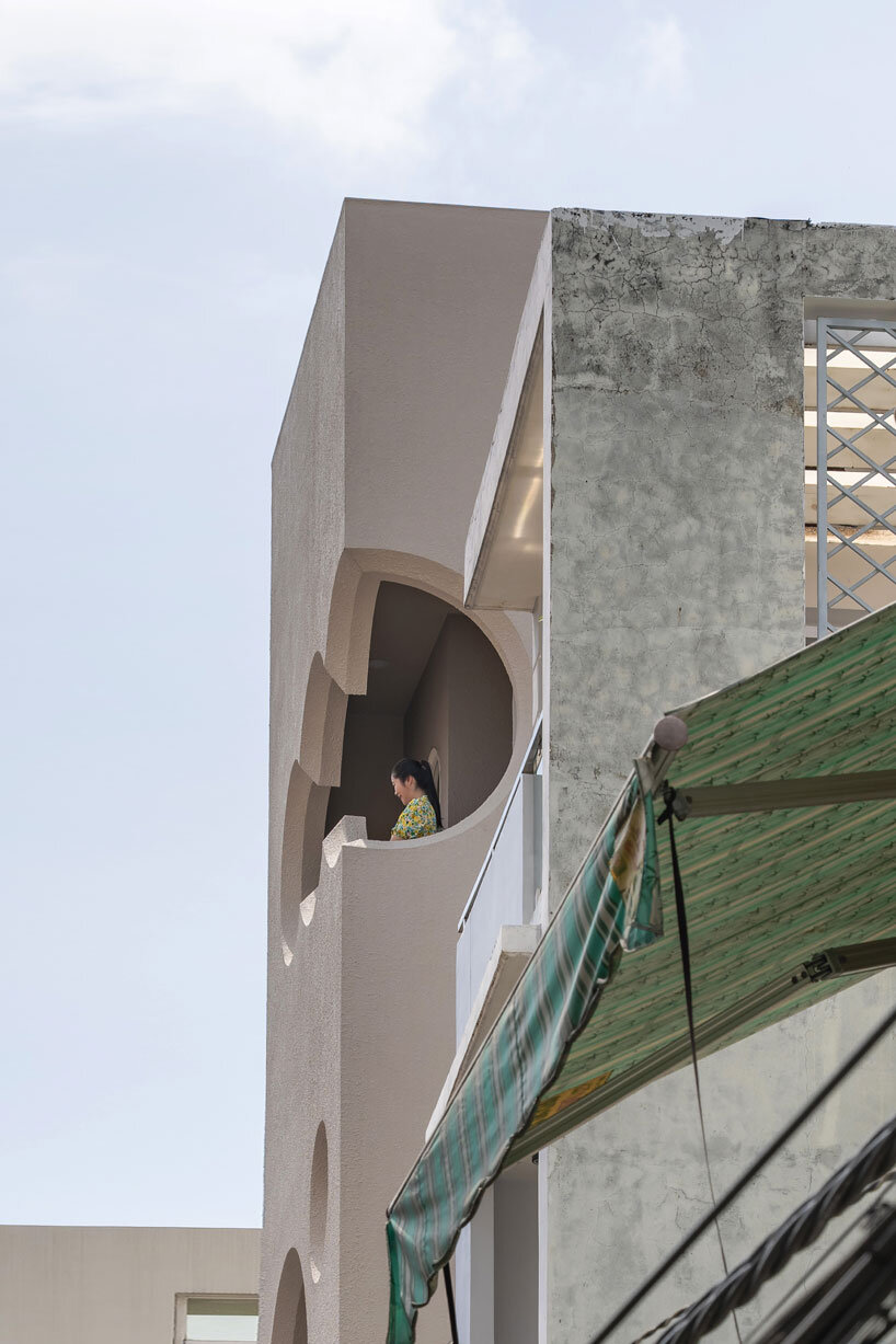 Cloud-shaped openings Pierce Urban co-life unit concrete facade in Vietnam