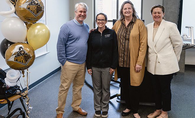 Purdue Nursing Professor Rebecca Johnson poses with her mentors and colleagues in her classroom.
