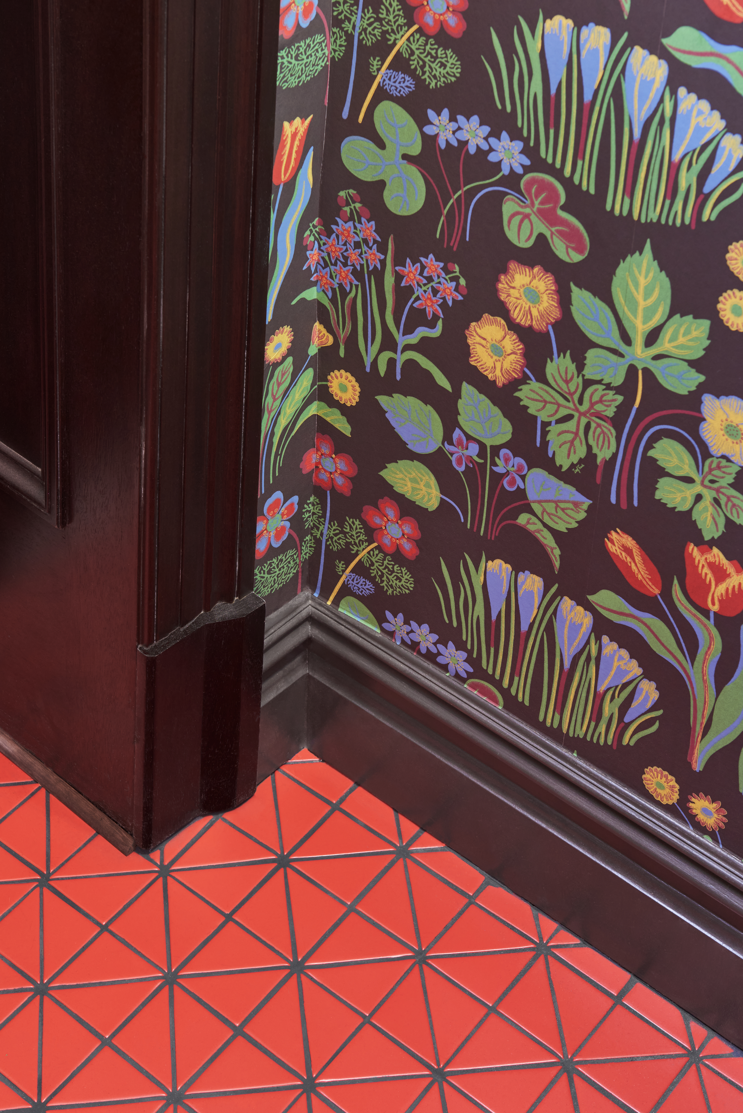 Detail red floor, flowering wallpaper
