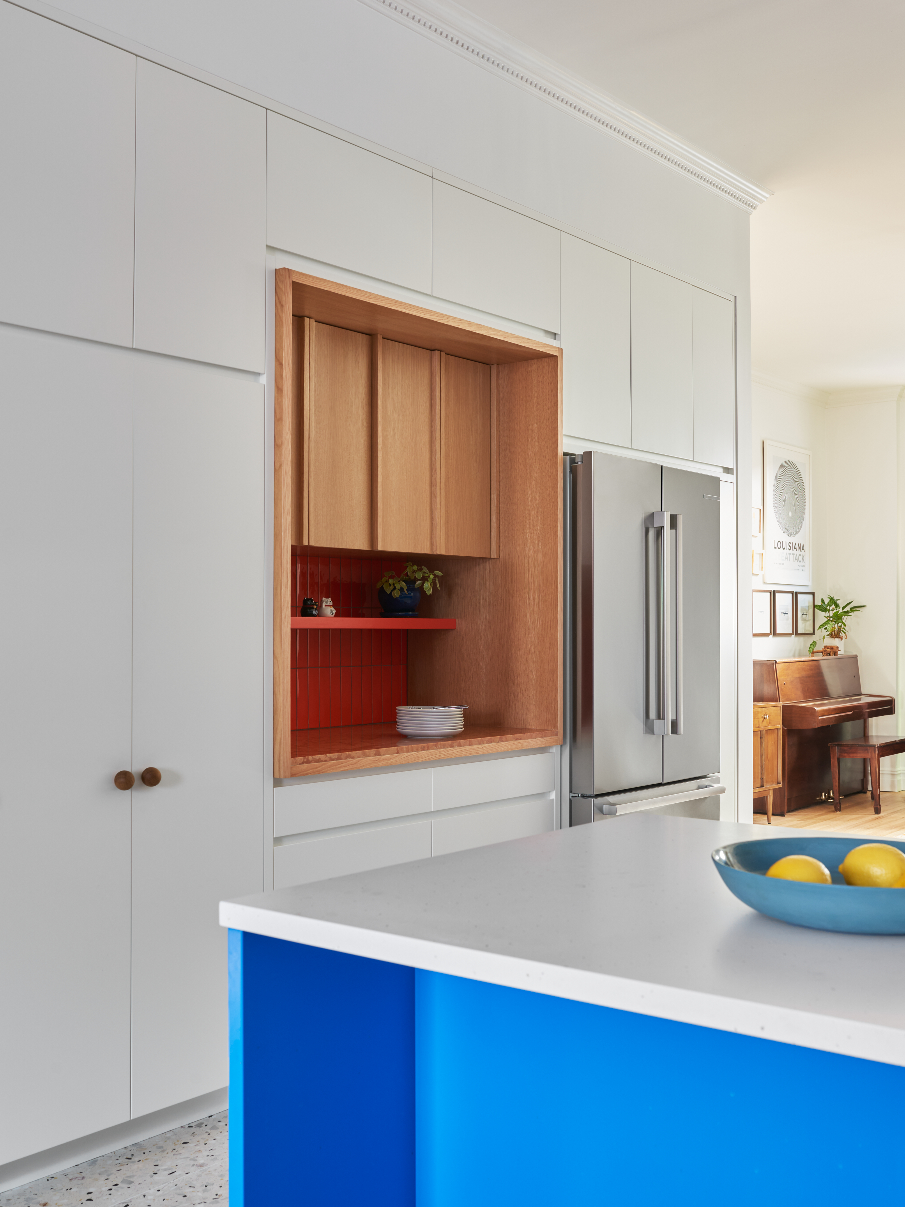 Kitchen memory wall with a millbone niche