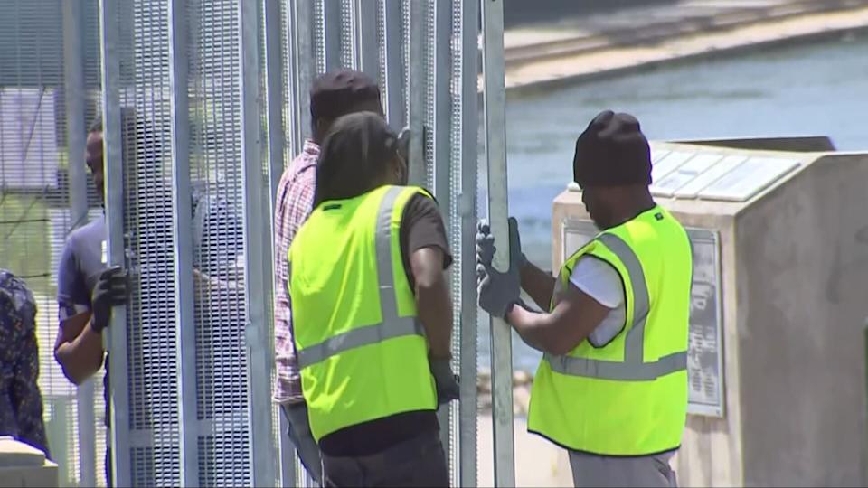 Fences, barricades around the NATO village, the coming down