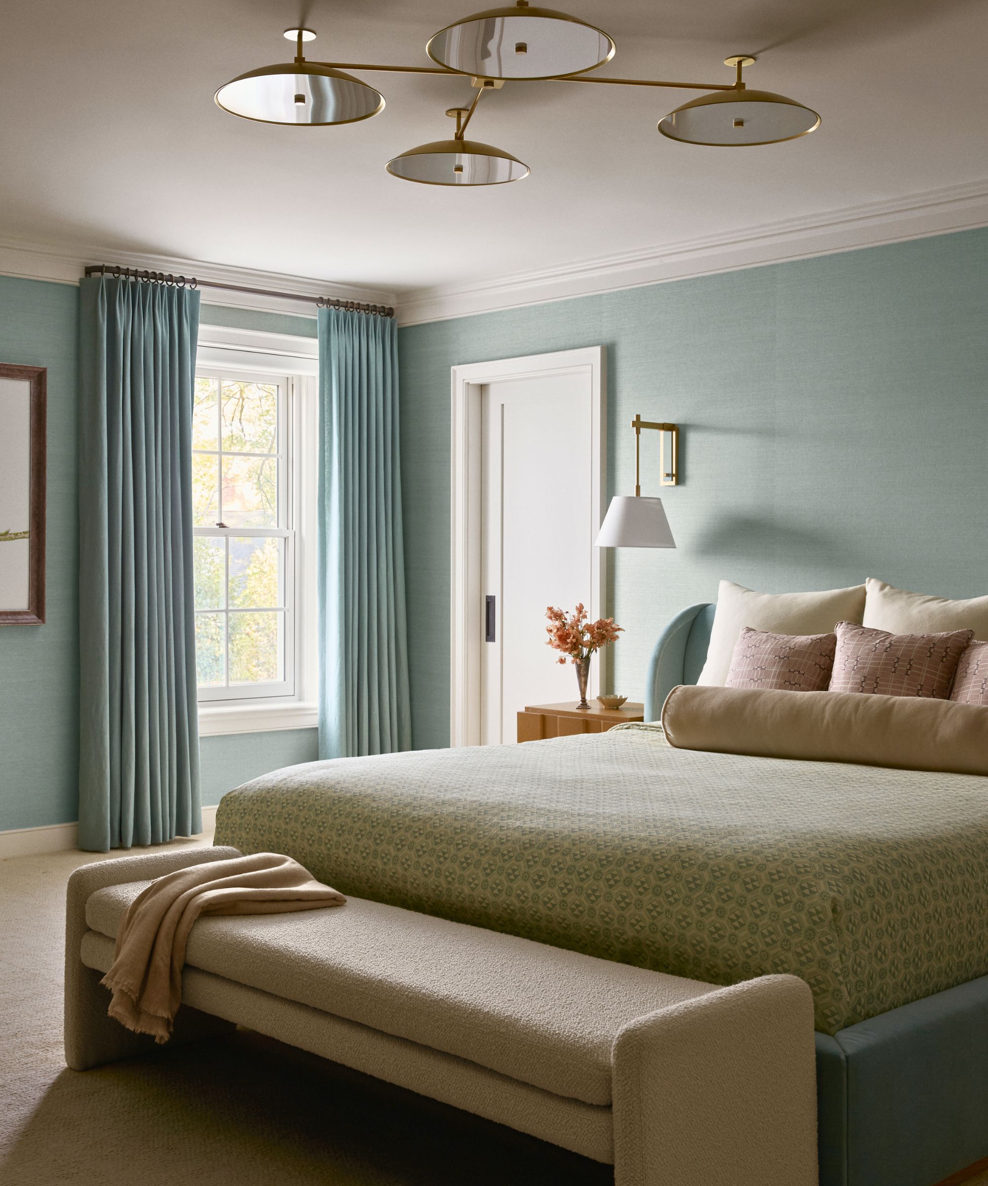 Bleed -blue bedroom with a blue bed and beige bank