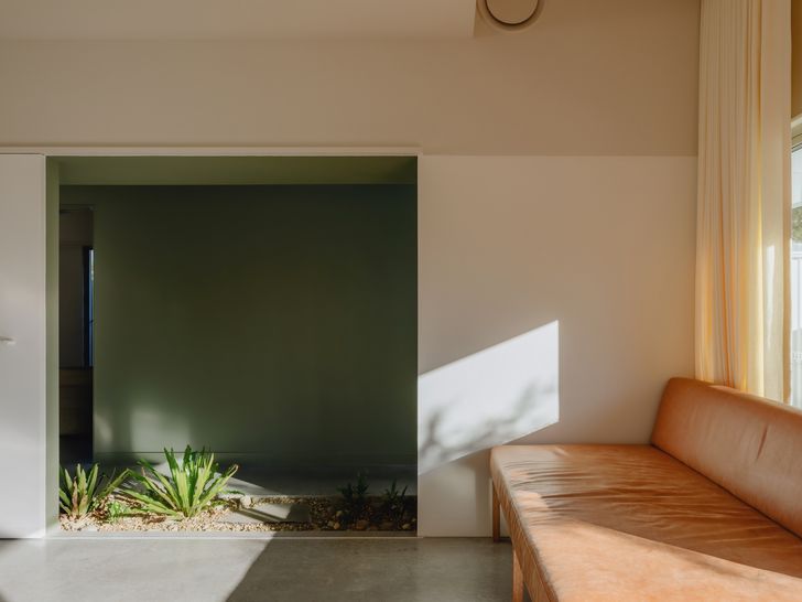 The main living area connects to the hallway and transforms the circulation space into an active and functional part of the house.