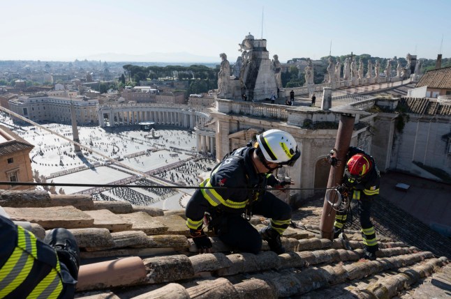This photo handout on May 3, 2025 by the Vatican media shows the establishment of the Sistine Chapel and installation of the chimney before the start of the conclave on May 7, 2025.