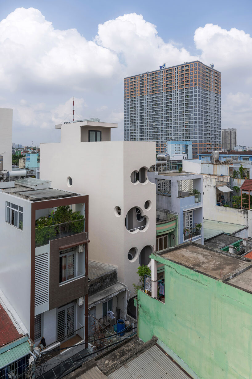 Cloud-shaped openings Pierce Urban co-life unit concrete facade in Vietnam
