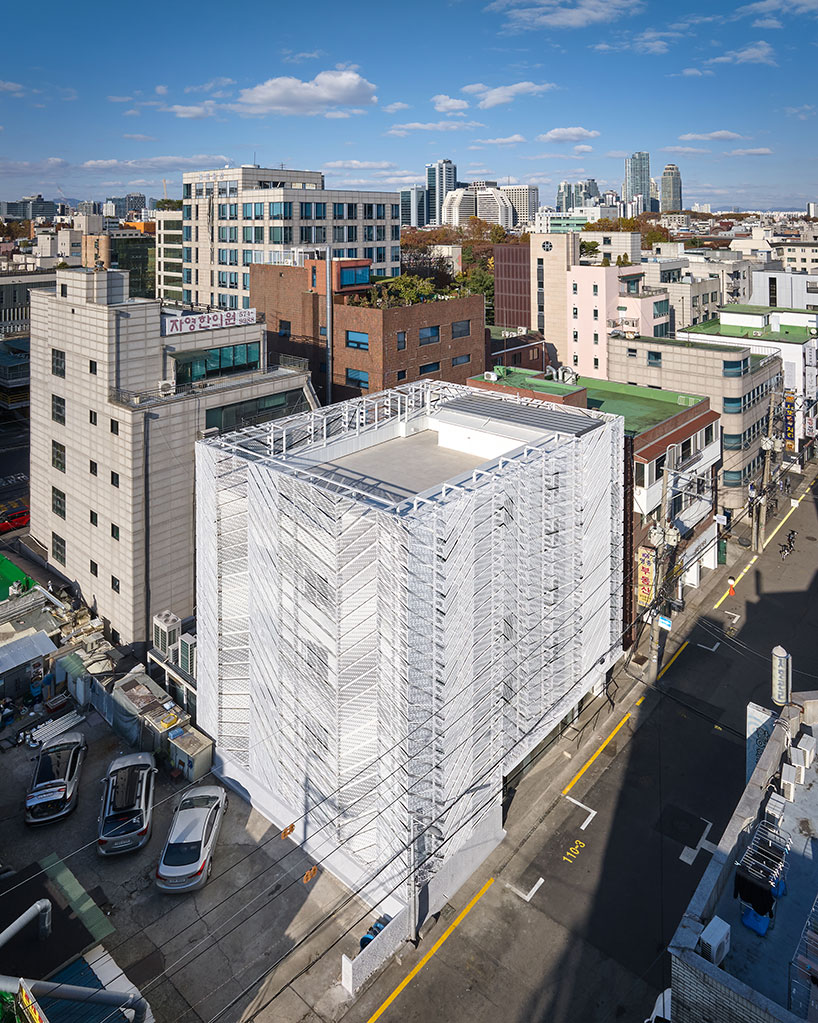 Perforated metal panels upgrade the outside of the building in responsive facade system in Seoul