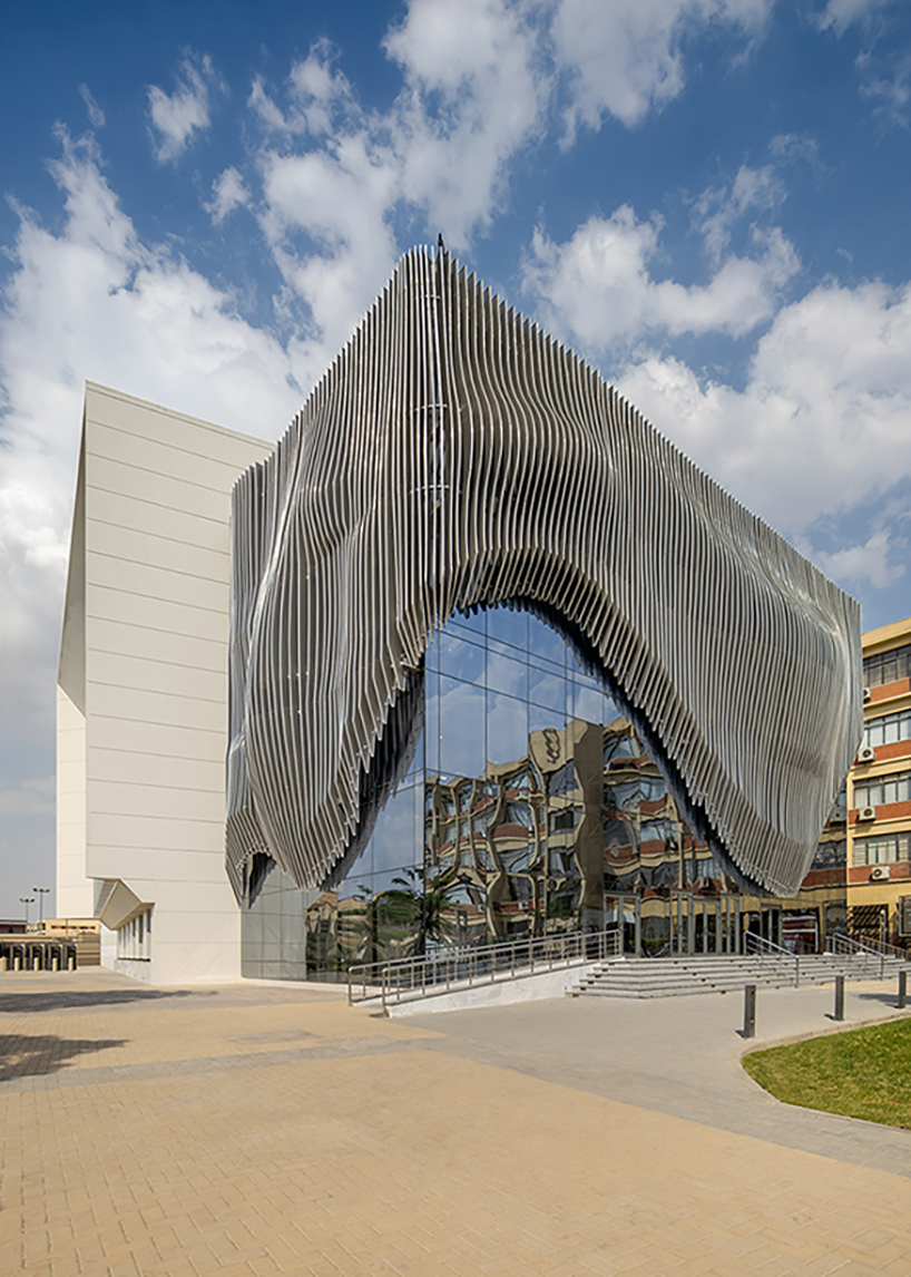 Wave -like aluminum curtain facade via the Ain Shams University Theater in Egypt