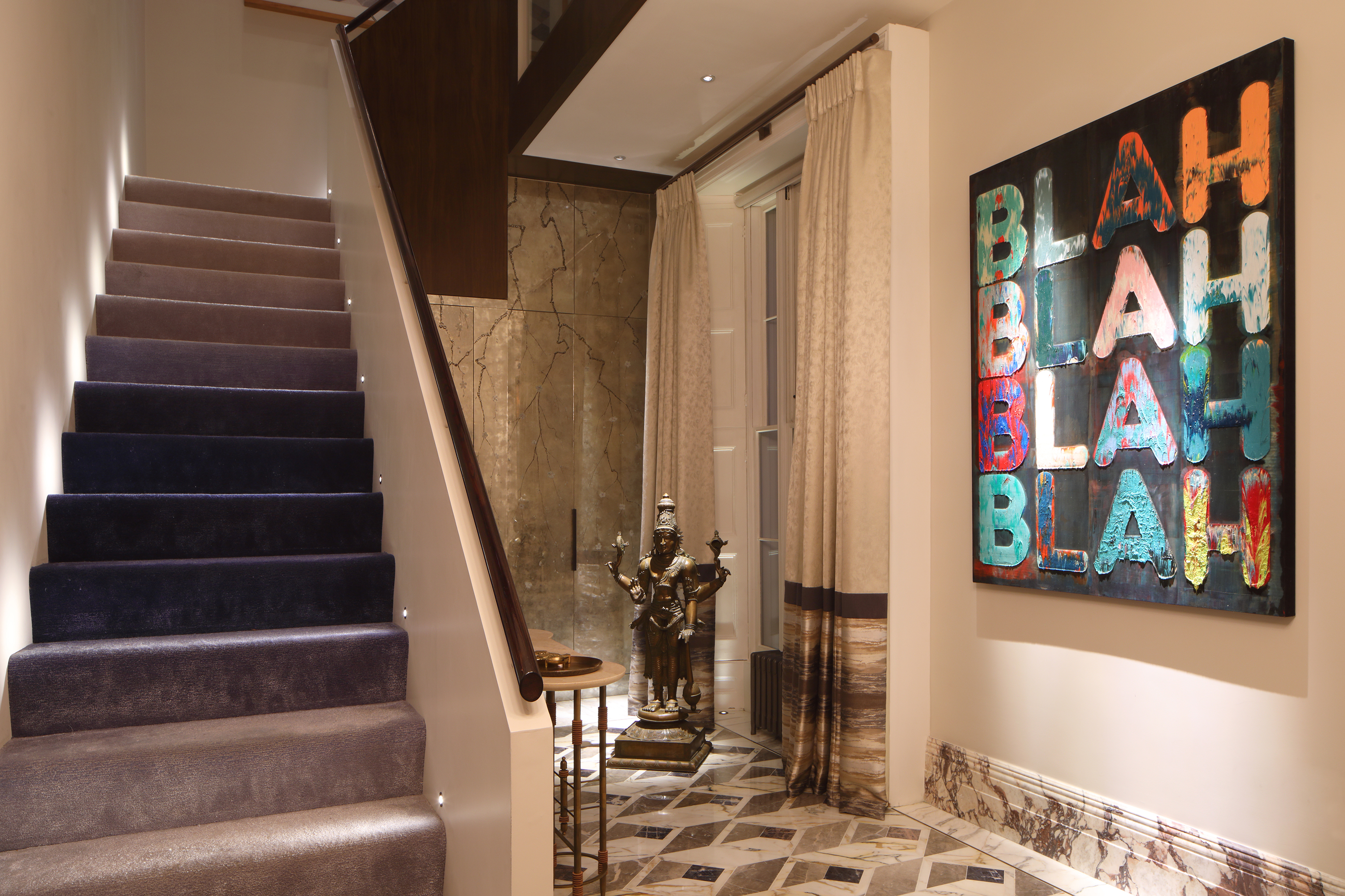 Interior with graphics artificial works with lighting design by John Cullen Lighting