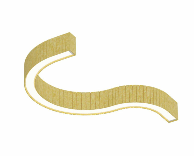Curved, gold-colored LED light with a segmented surface that is viewed against a simple white background.