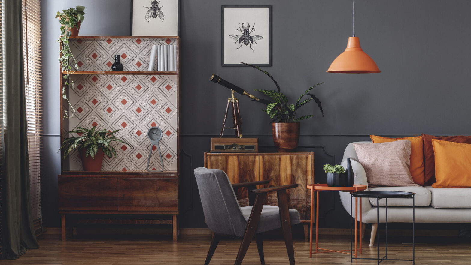 How to have orange wooden furniture and gray walls work together