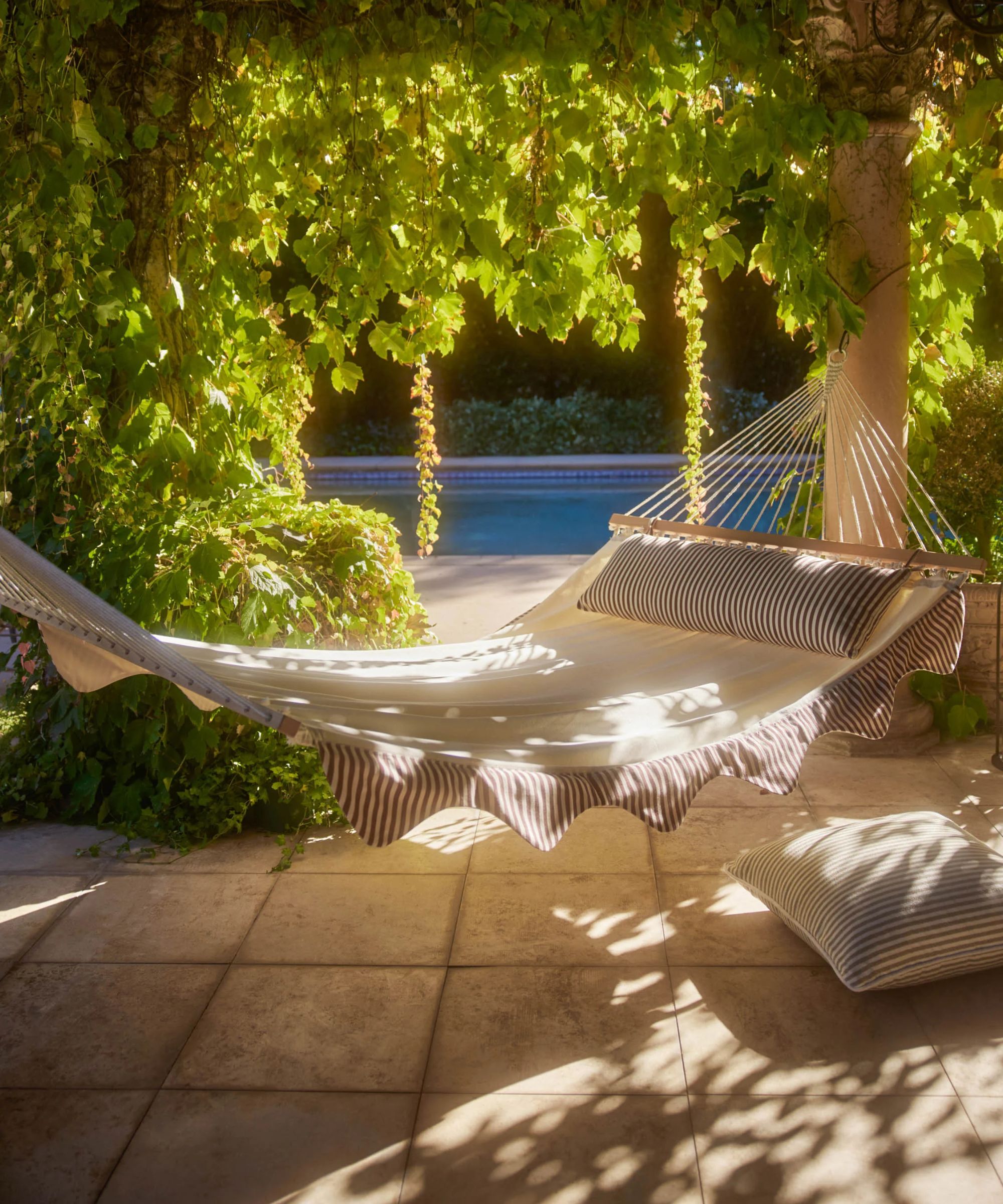 Lulu and Georgia hammock with striped scallop edges and a suitable pillow
