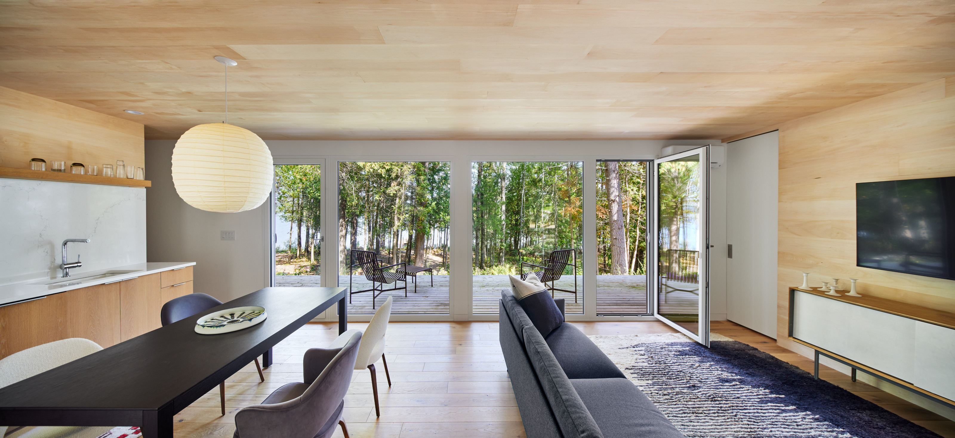 The main living space in the Lakeside cabin by Snow Kreichen Architects