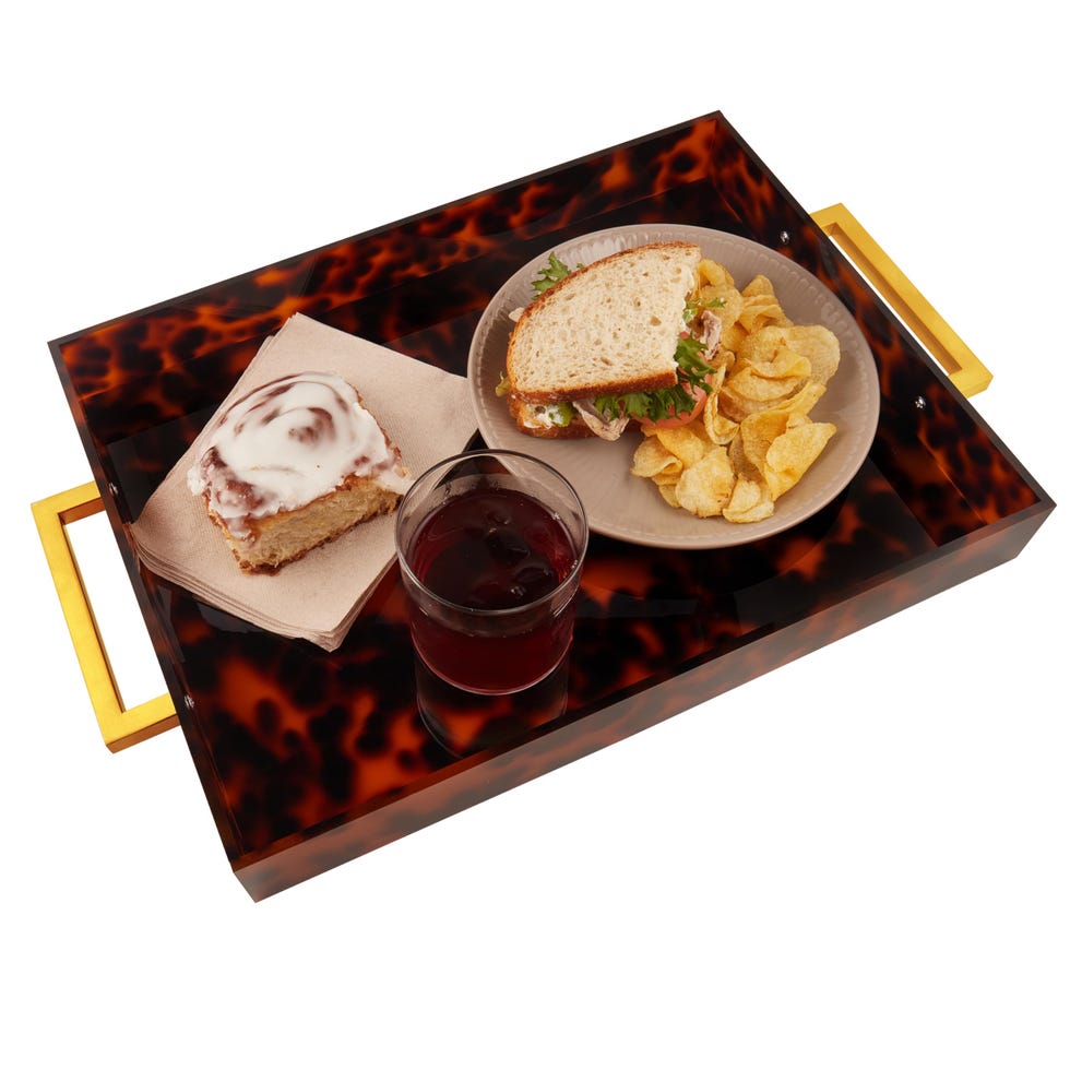 Acrylic serving shell with golden handles Acrylic serving shell with golden handles