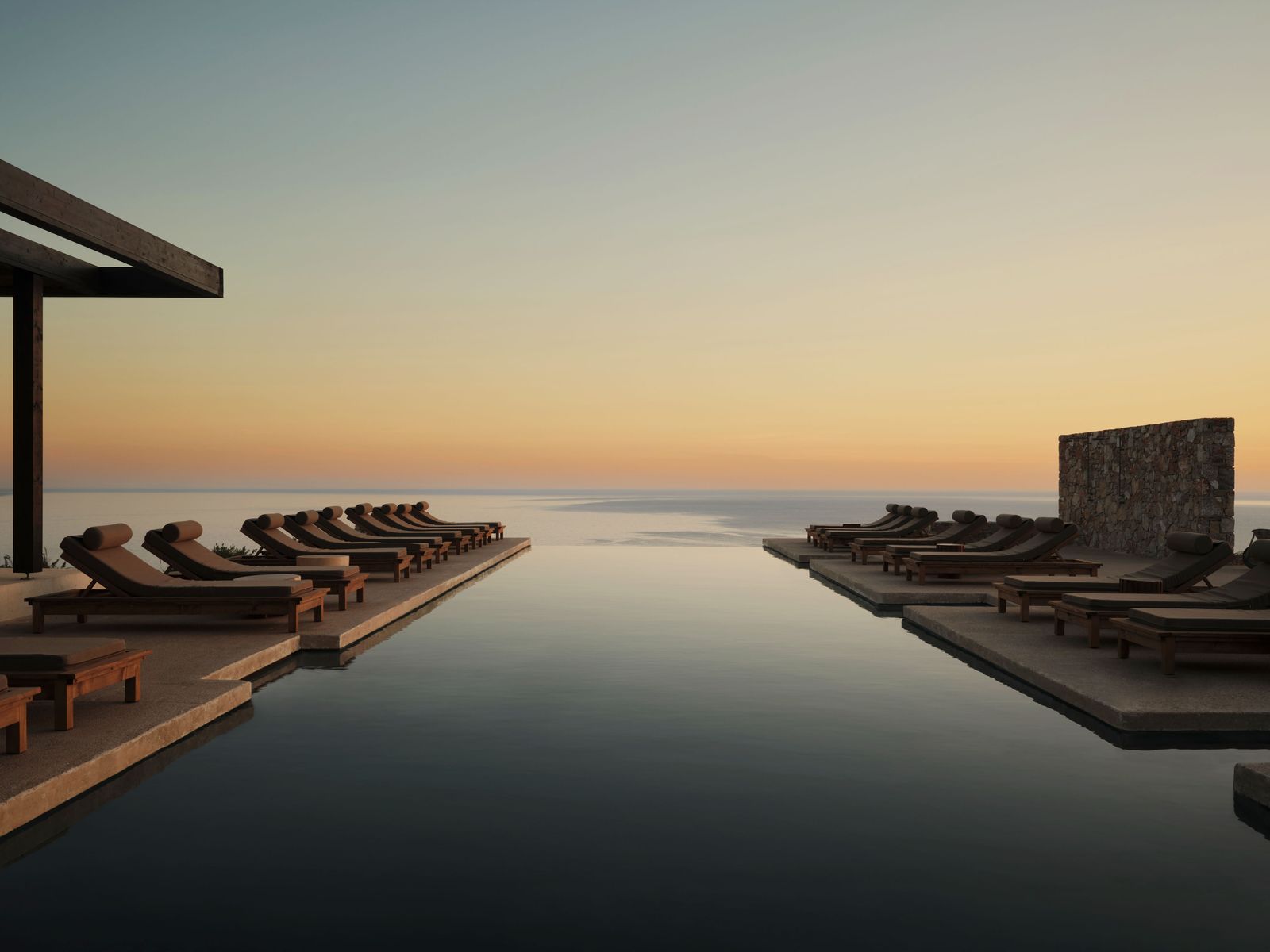 Image can contain nature outdoors in the open sky Horizon water water pool swimming pool chair and furniture