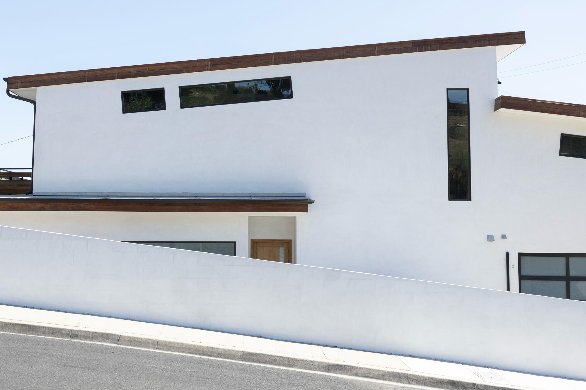 A new, modern house with a sloping roof in the Monterey Park.