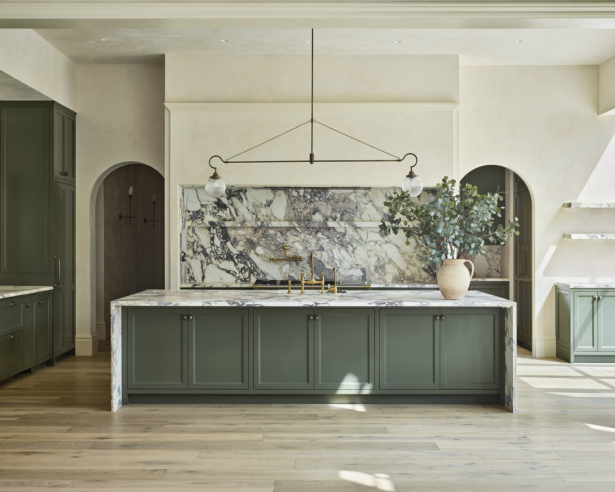 Green kitchen with marble backplash