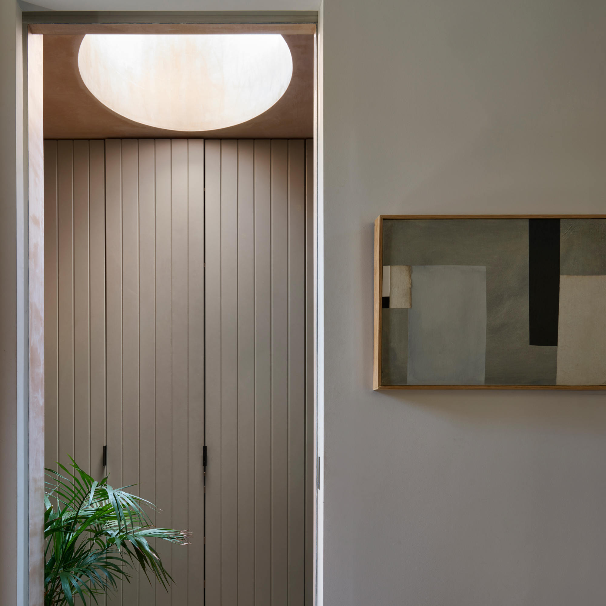 Hallway with skylight and equipped storage space stacks