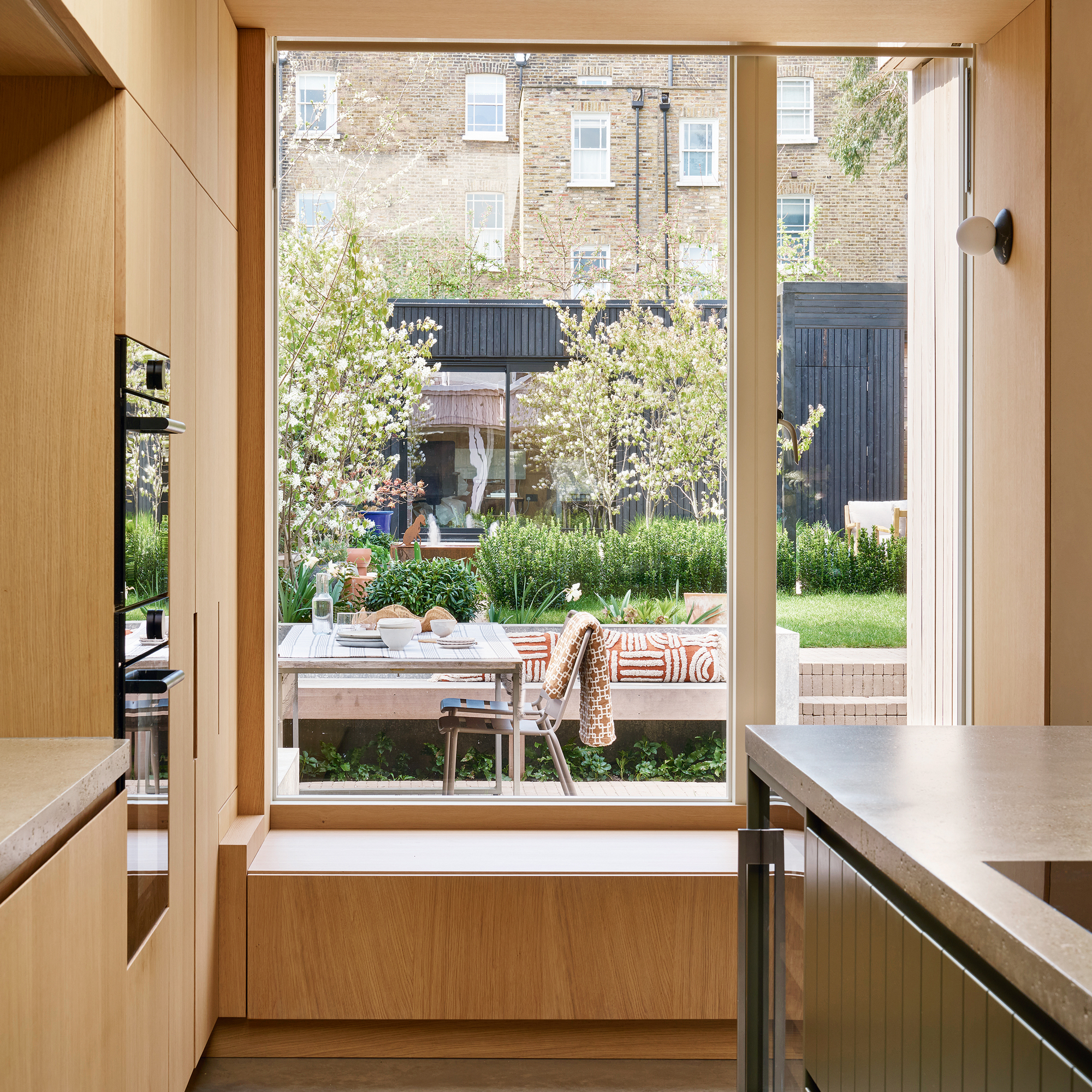 View from a kitchen to a large garden over a large frost window