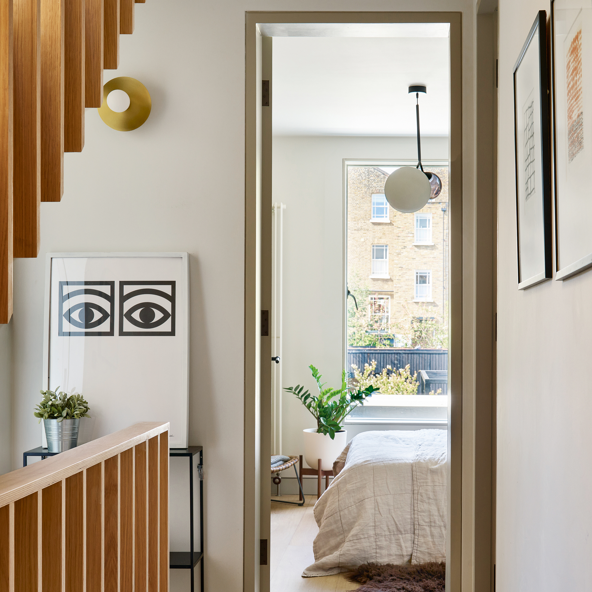 The hallway and landed next to a staircase that leads into a bedroom