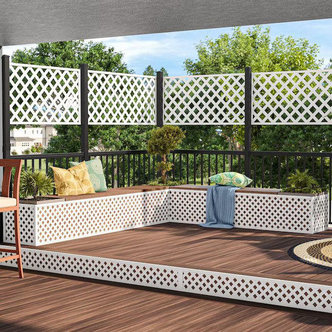 Deck with white lattice fences and built -in planters.