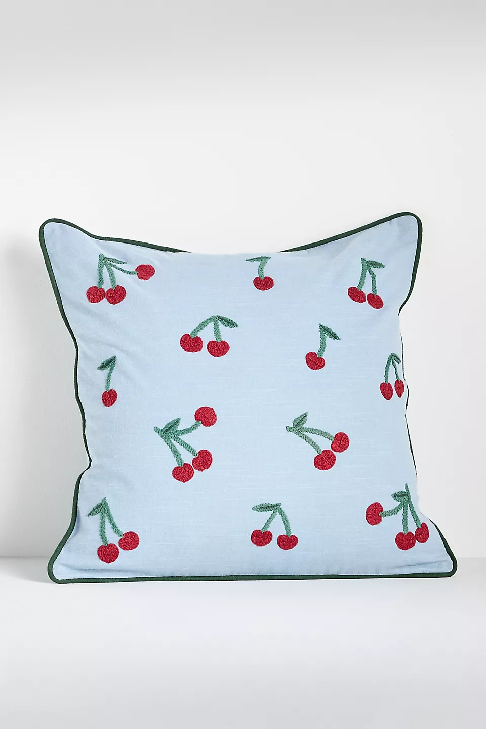 Cherry pillow in light blue