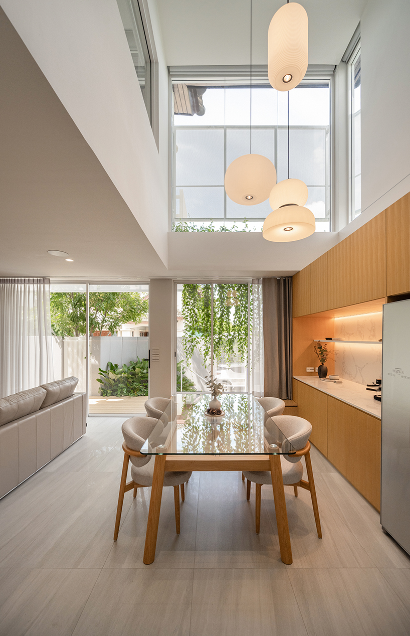 curved textile facades wrap the reborn house in Bangkok Village, which soft