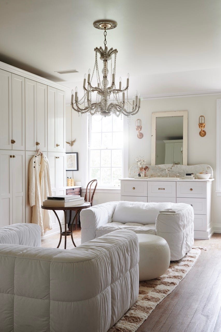 Cozy bright room with modern furniture and chandelier