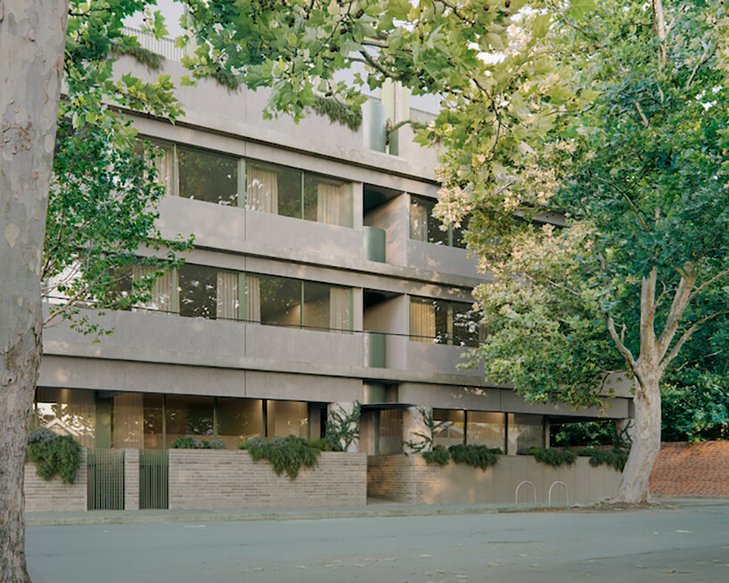 The monolithic apartment complex is contrasting with the green Fitzroy StreetScape in Melbourne