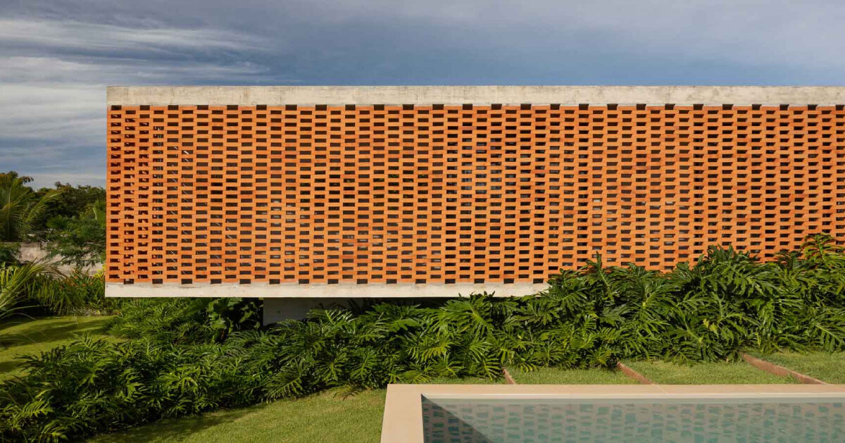 Fernanda Padulas concrete house in Brazil dots the brick facade