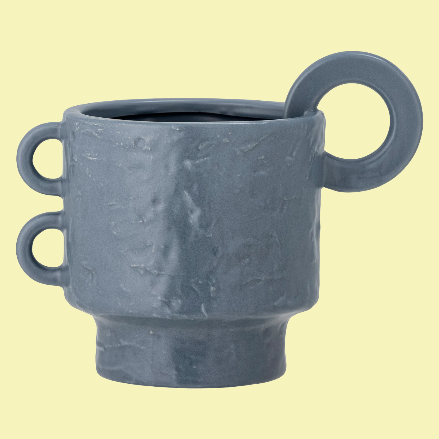 A structured pot with switched handles in dusty blue