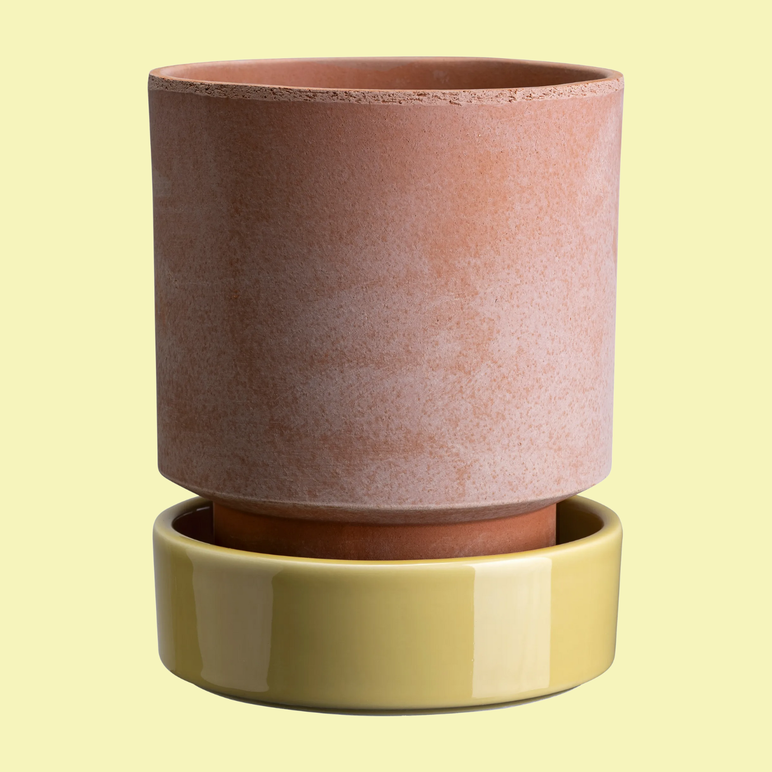 A terracotta planter with a lower butter -yellow glass layer -layer