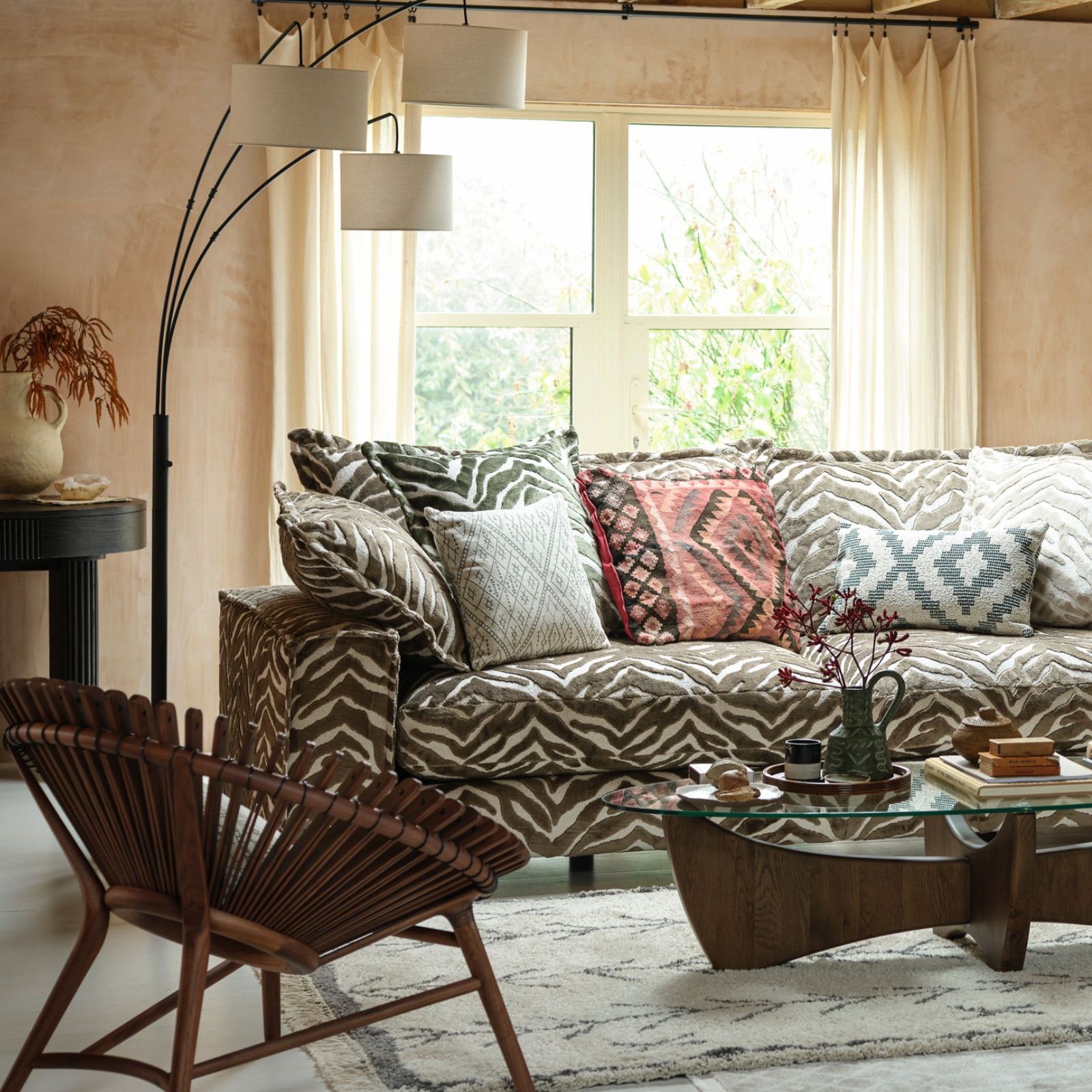 Subtle zebra printing furniture in white and brown colors with Aztec pillow