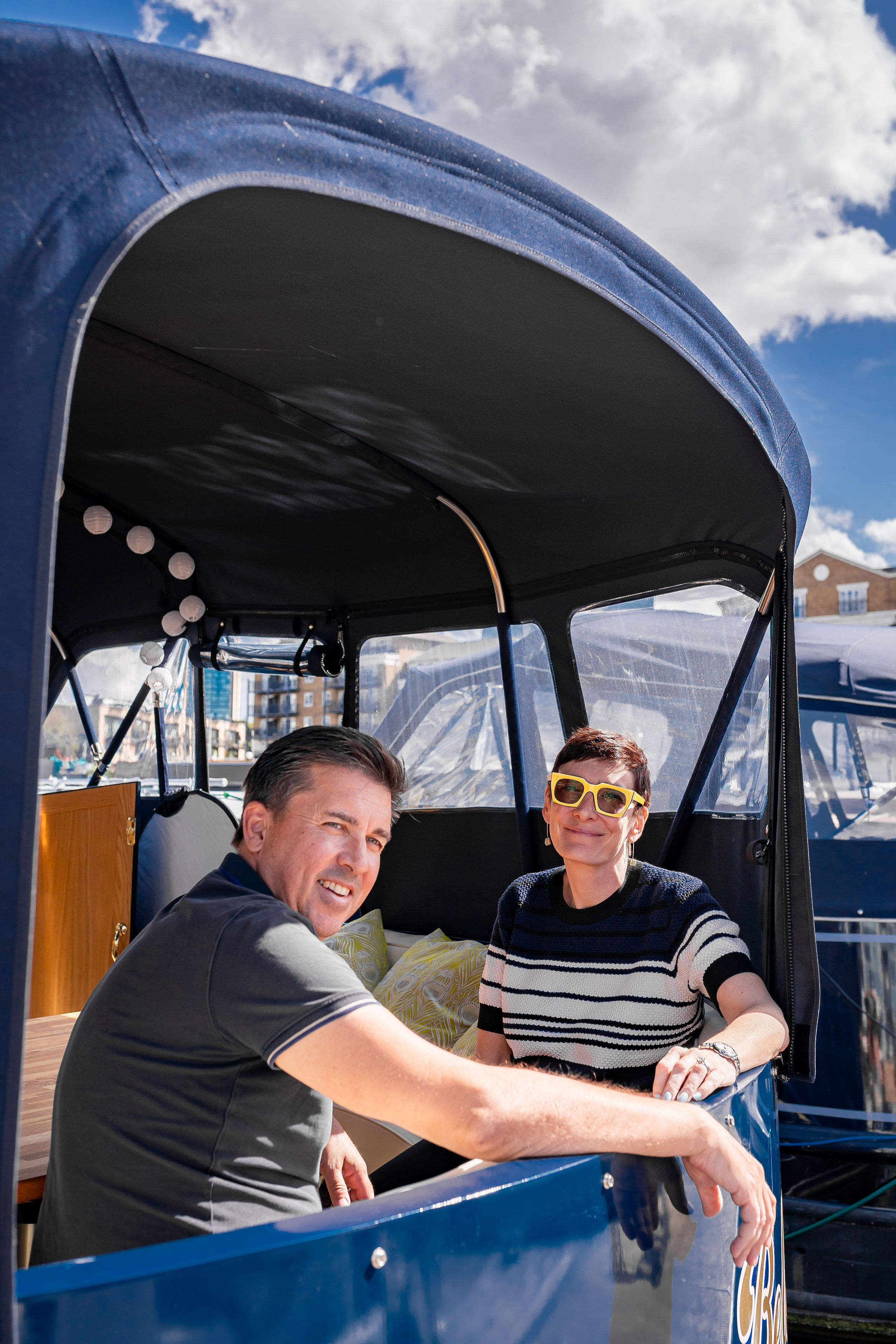Julian Pollitt and Monica Parker sit in their new boat in Southern Belle.
