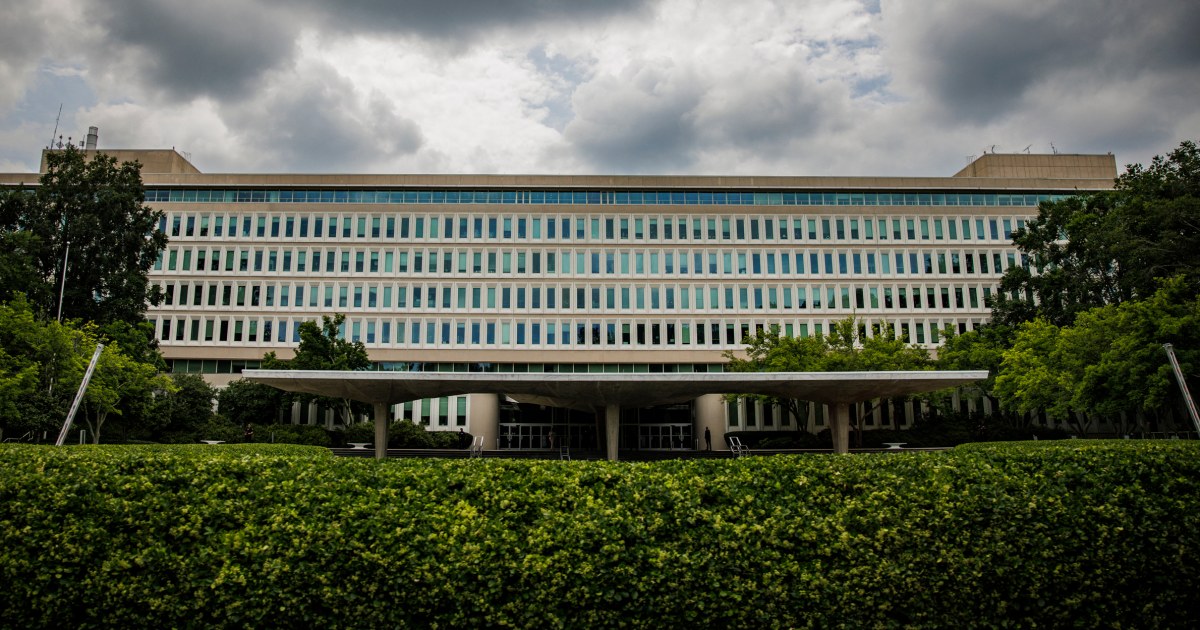 Construction workers flee to fences around the CIA headquarters in front of ice raids