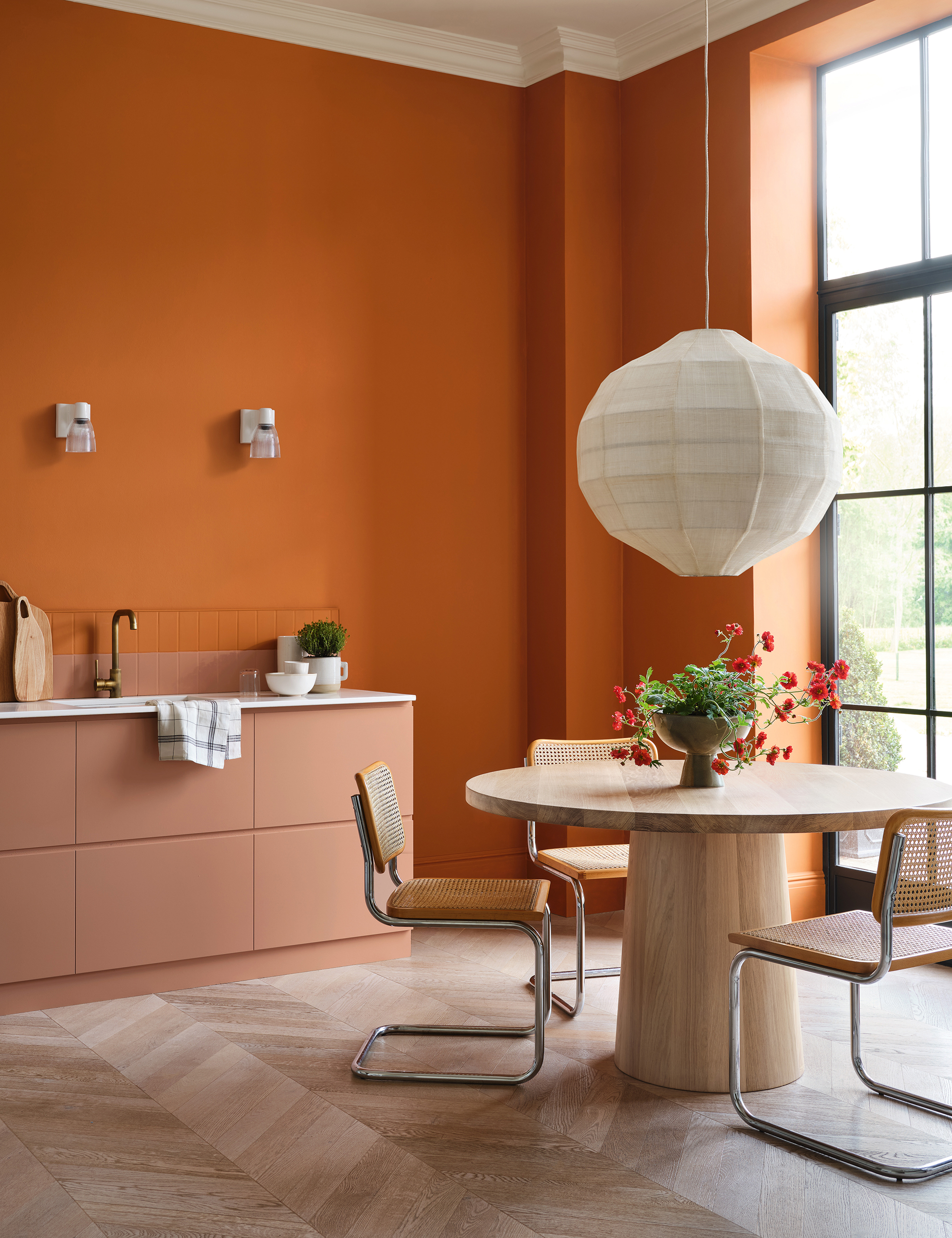 Open kitchen with orange painted walls