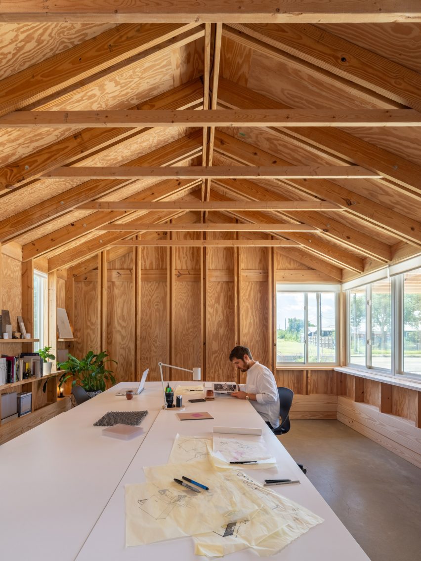 The architect's studio with a parked ceiling and the exposed wooden frame