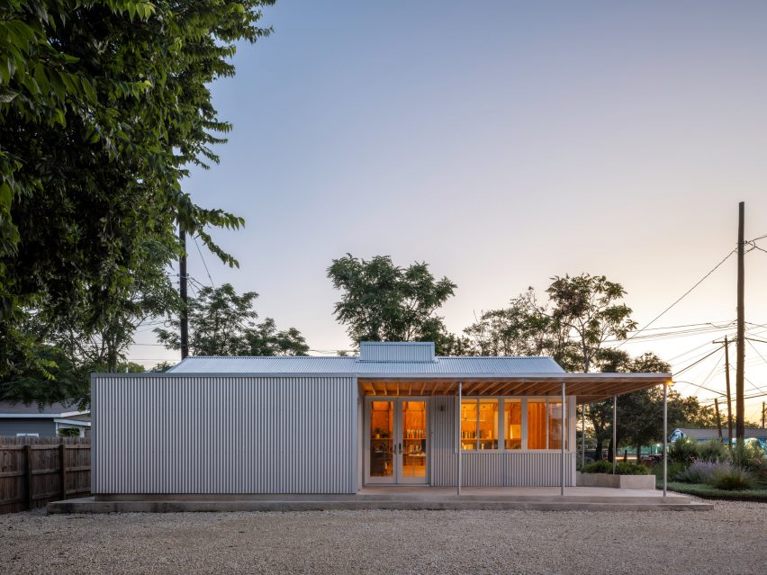 Outer of a one -story, metal cladding building at dusk