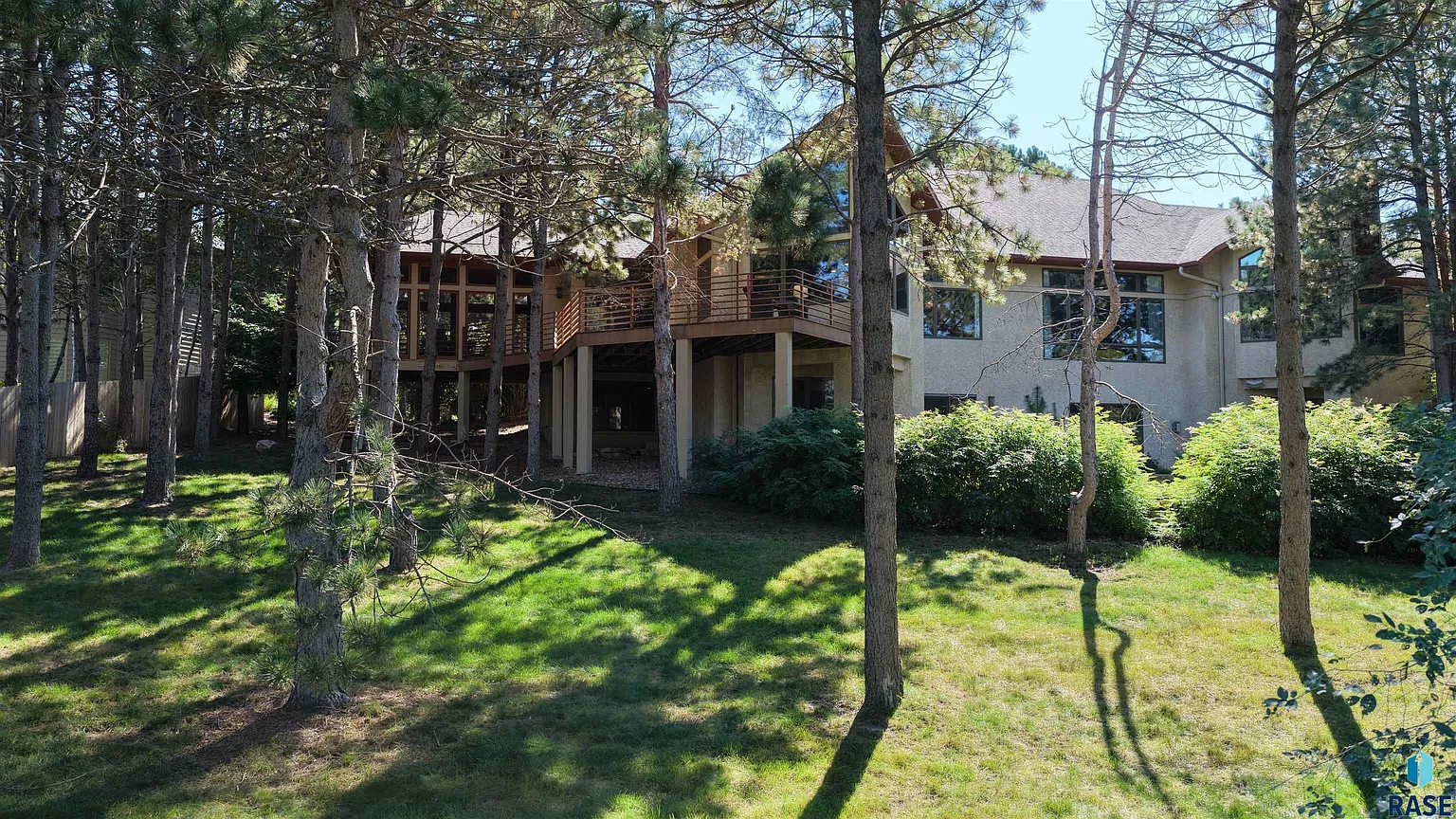 Embrace the spirit of Frank Lloyd Wright in this stunning custom home