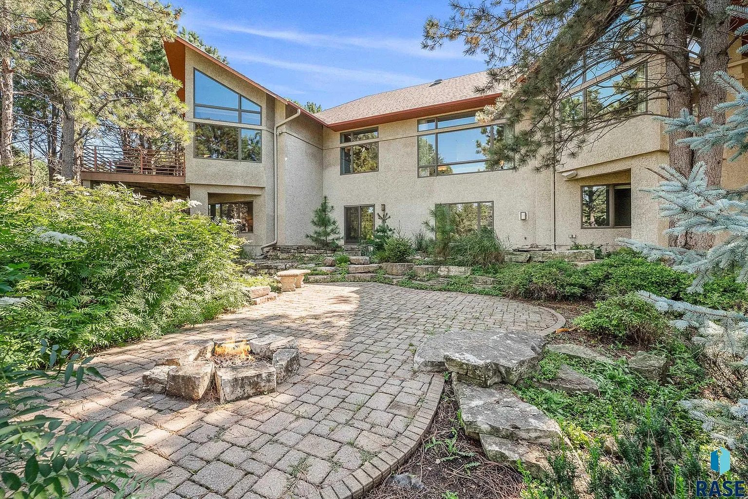 Embrace the spirit of Frank Lloyd Wright in this stunning custom home