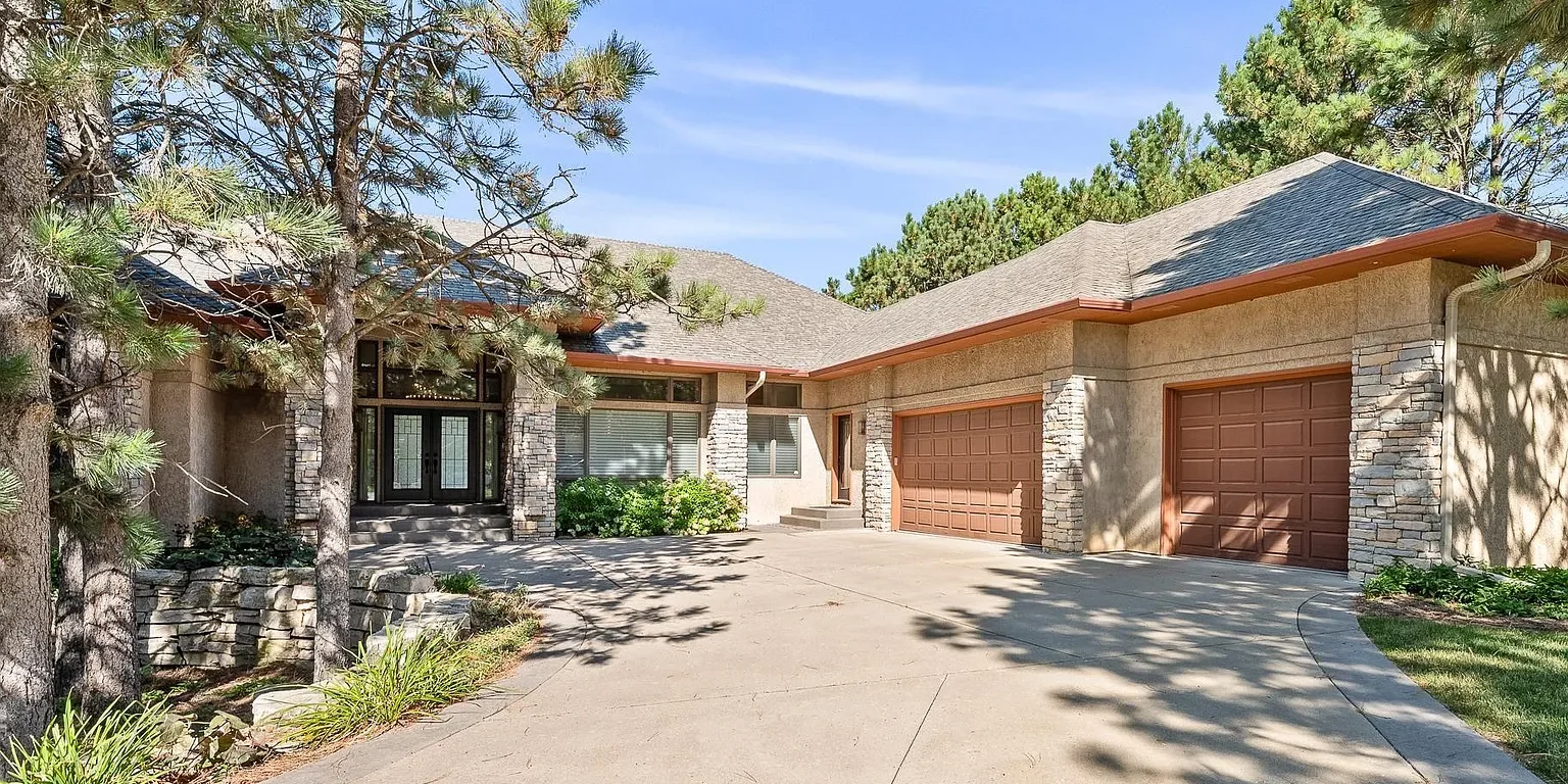 Embrace the spirit of Frank Lloyd Wright in this stunning custom home