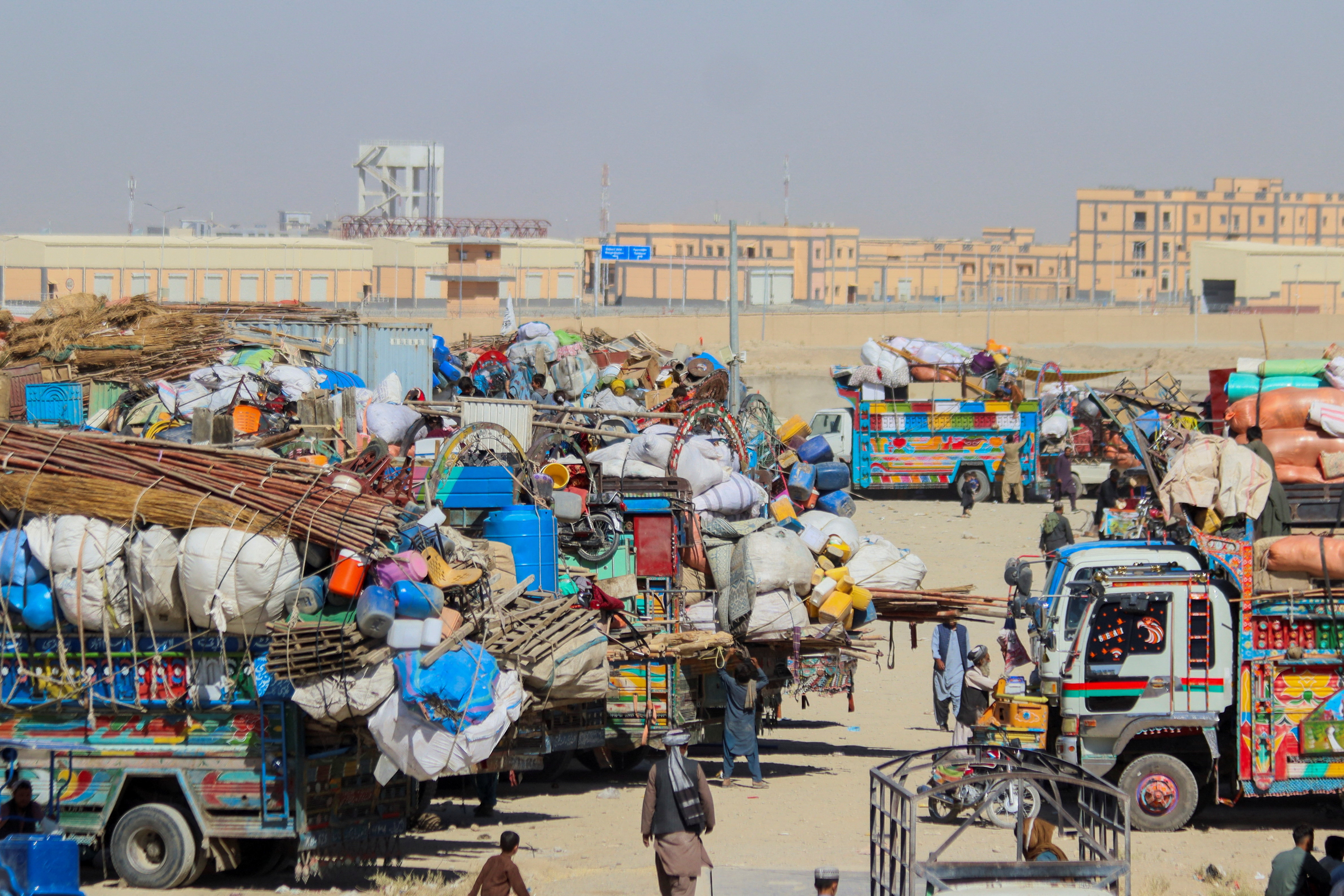 Afghan citizens' belongings in parked vehicles on the way back to their country after Pakistan closed the border crossing.