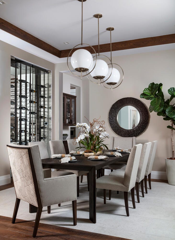 Formal dining room with dark wood table and upholstered chairs
