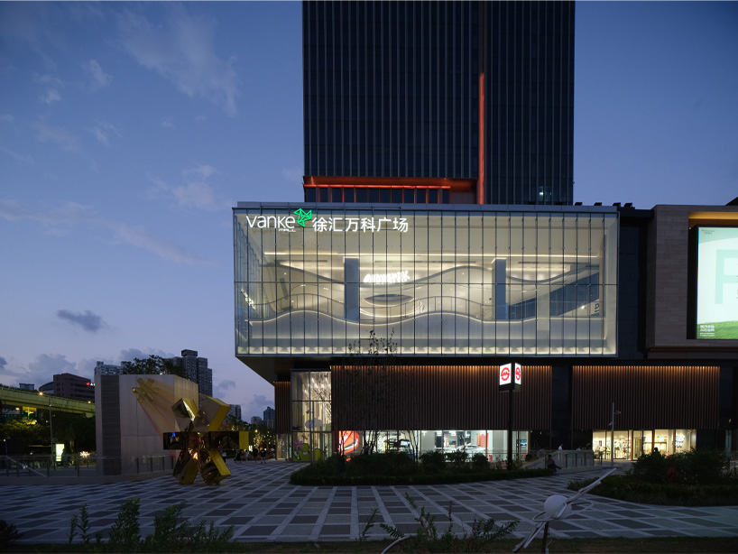 The curved urban skate park set within a floating glass volume offers views of the Shanghai skyline