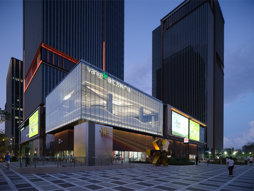 The curved urban skate park set within a floating glass volume offers views of the Shanghai skyline