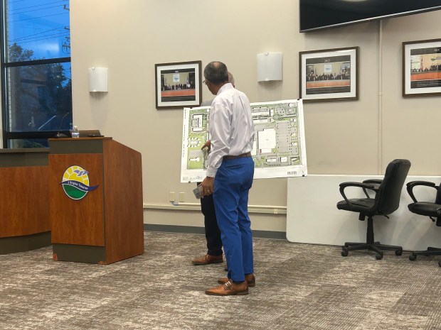 Steven Pittman asks Brian Meng, principal architect at Bialosky Cleveland, questions about the development on Oct. 28. (Frank Mecham-The News-Herald)