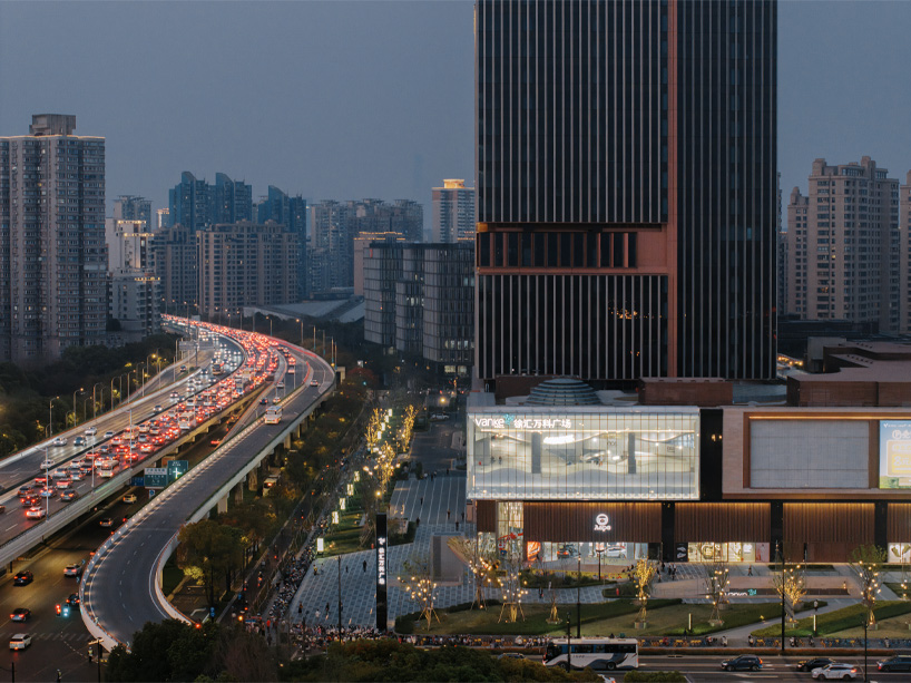 The curved urban skate park set within a floating glass volume offers views of the Shanghai skyline