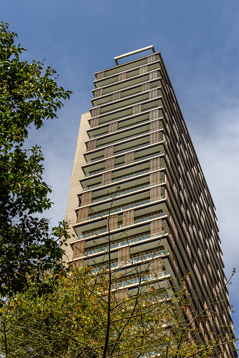 Kinetic wood panels run across the facade of Perkins&Will's residential tower in São Paulo