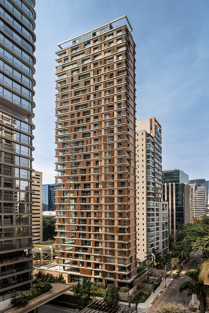 Kinetic wood panels run across the facade of Perkins&Will's residential tower in São Paulo