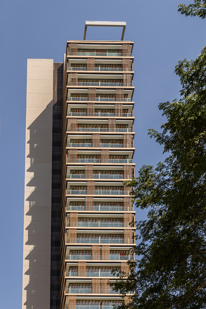 Kinetic wood panels run across the facade of Perkins&Will's residential tower in São Paulo