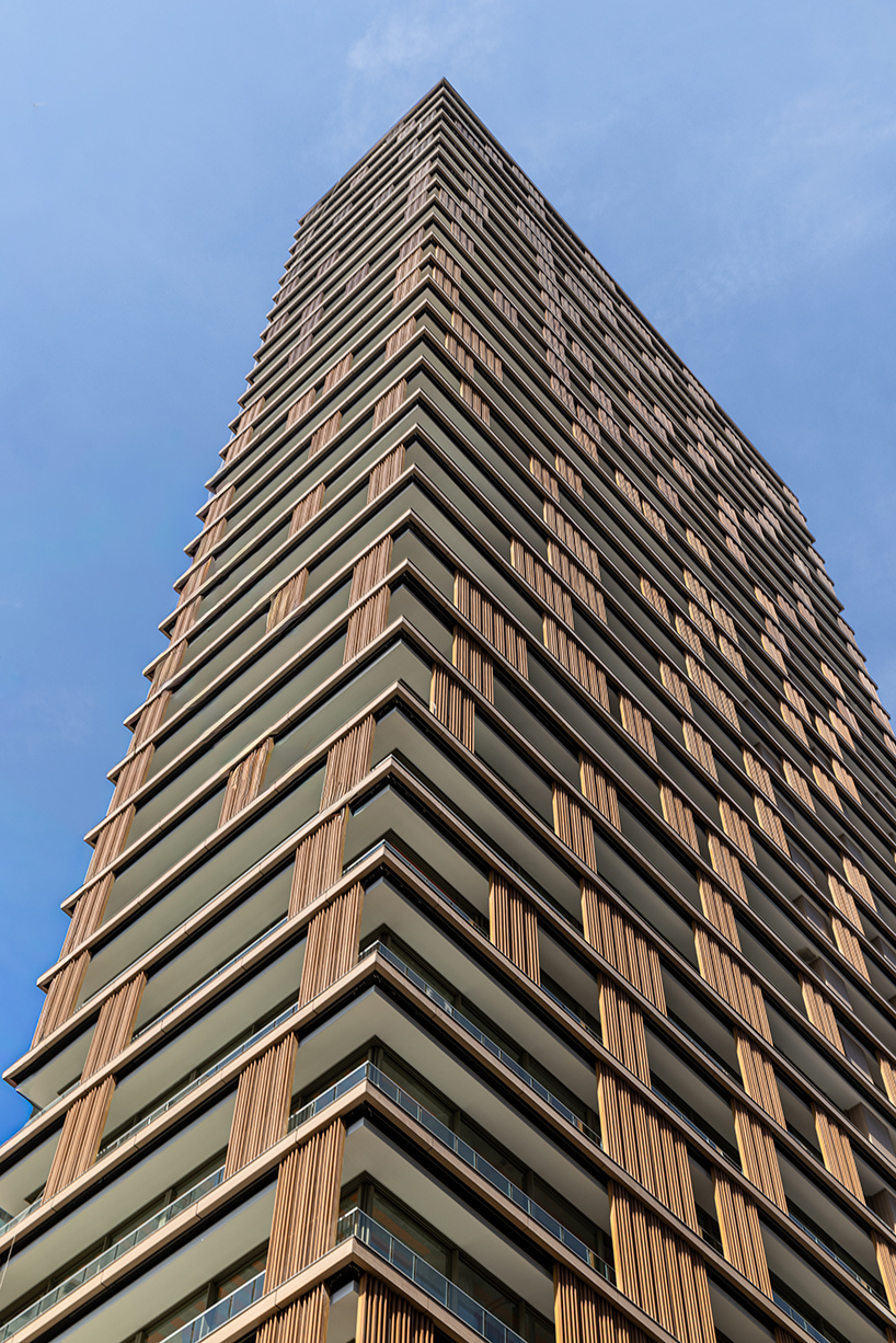 Kinetic wood panels run across the facade of Perkins&Will's residential tower in São Paulo